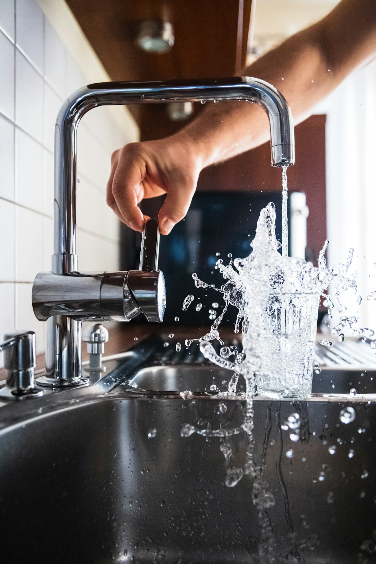 Illustration of a chrome tap with a water drop