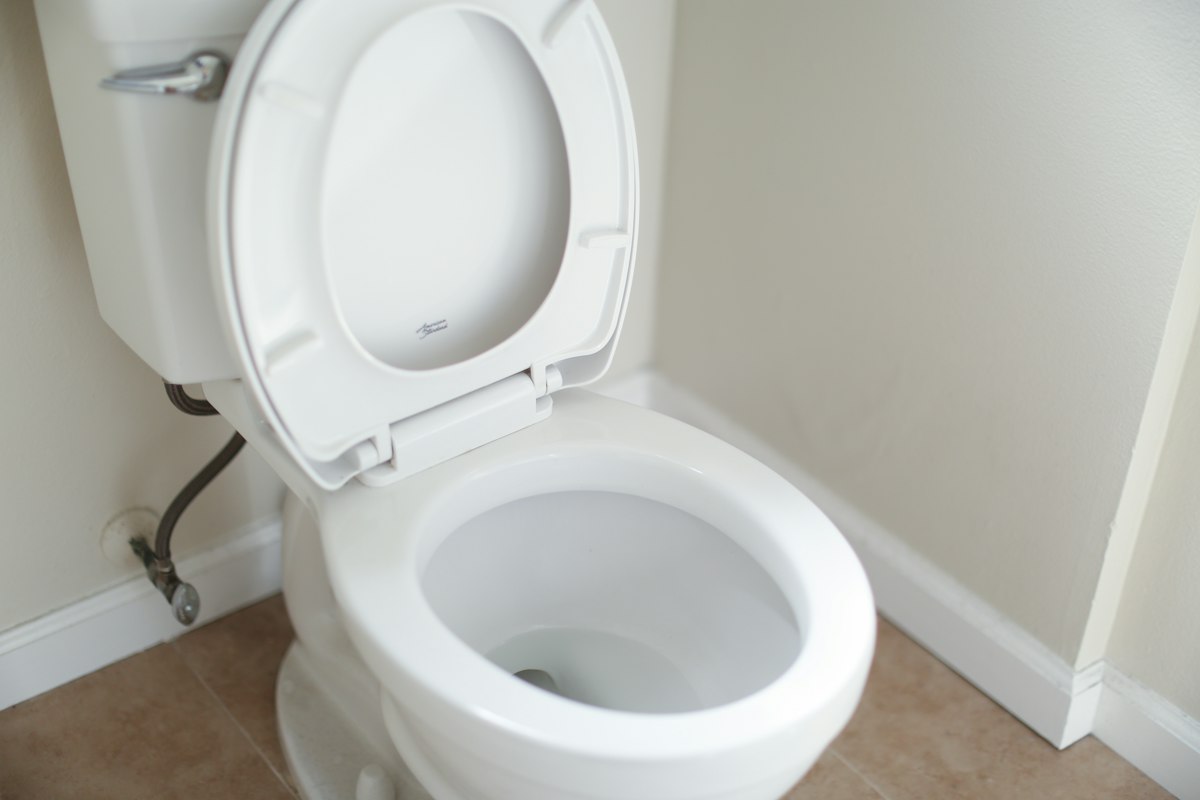 Illustration of a new sitting toilet being installed